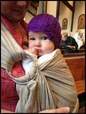 baby with CLICK for Babies purple cap